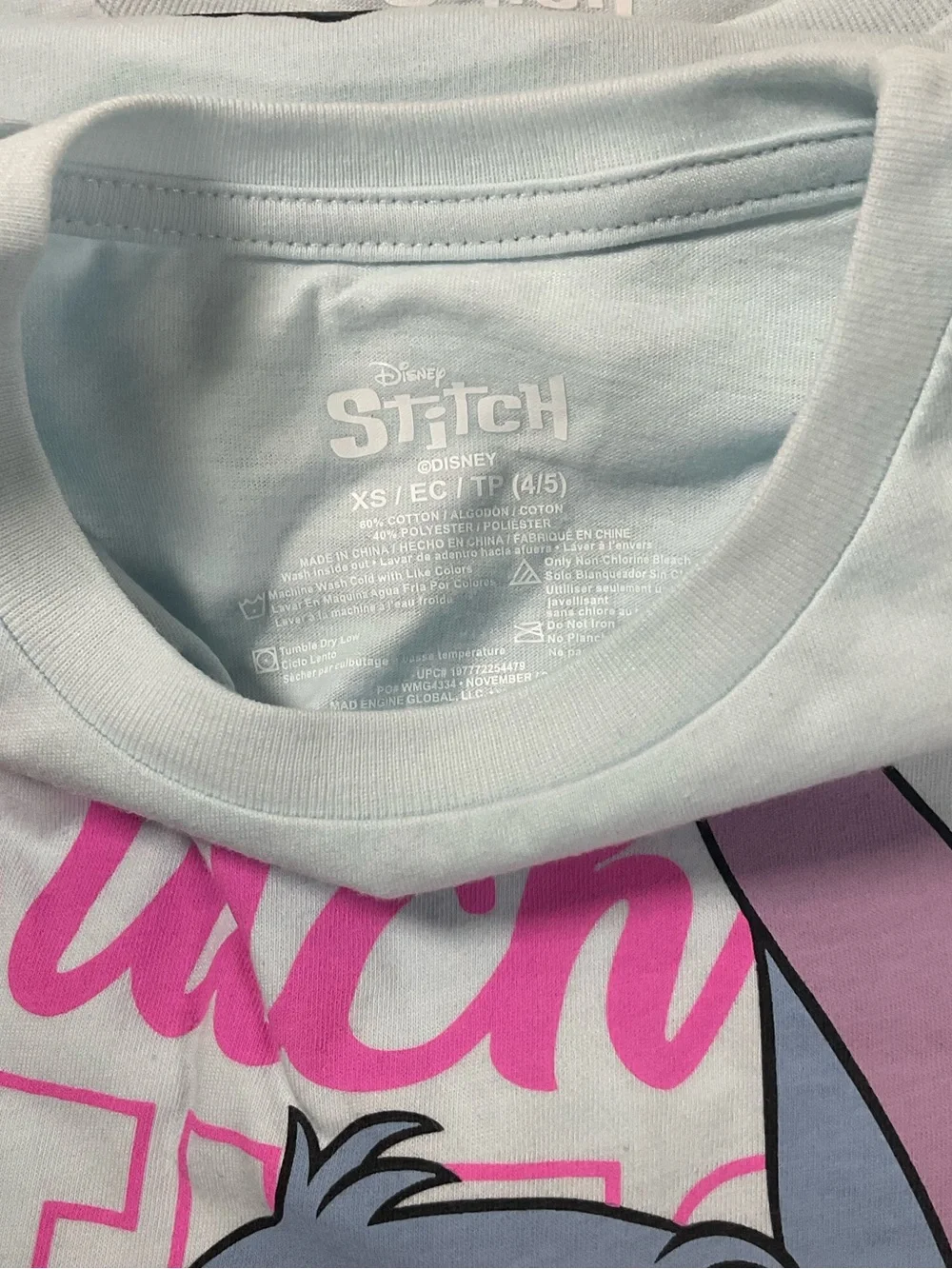 Disney Light Blue Stitch Tee with Pink and Purple. New with Tag.size L(10/12)